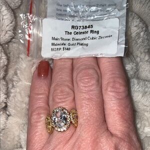 The Celeste Gold Ring with Clear Oval Center Stone